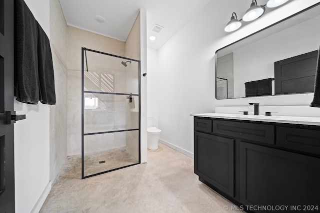 bathroom featuring vanity, concrete floors, toilet, and a shower with shower door