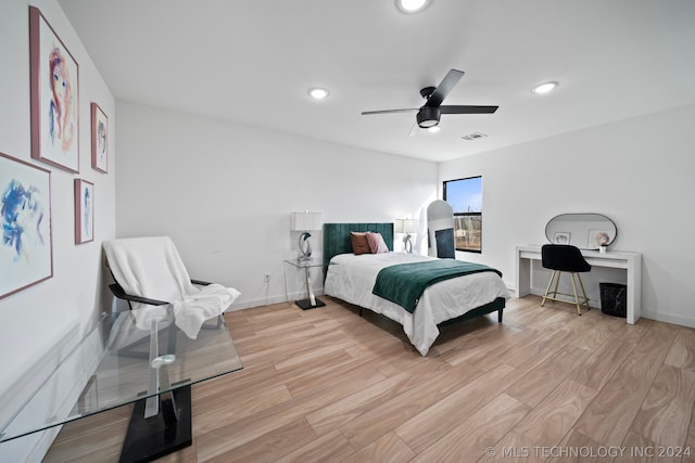 bedroom featuring ceiling fan and light wood-type flooring