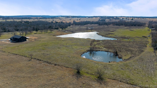 drone / aerial view with a rural view and a water view