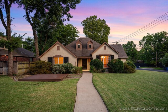 view of front of property with a yard