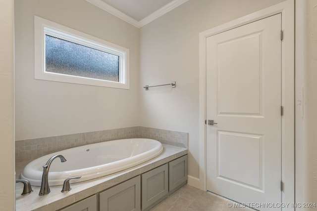 bathroom with ornamental molding, tile patterned flooring, and a bath