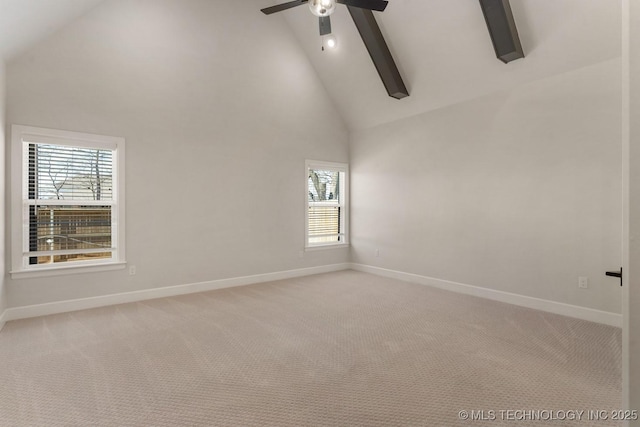 spare room with ceiling fan, high vaulted ceiling, light colored carpet, baseboards, and beamed ceiling