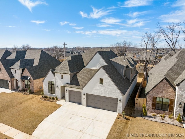 french provincial home with a garage, a shingled roof, concrete driveway, a residential view, and a front lawn