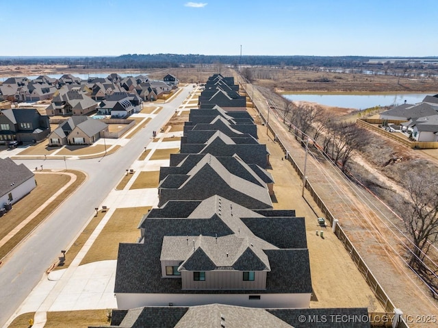 aerial view featuring a residential view and a water view