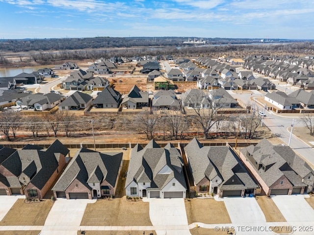 birds eye view of property with a residential view