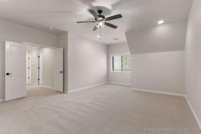 interior space featuring light carpet, recessed lighting, and baseboards