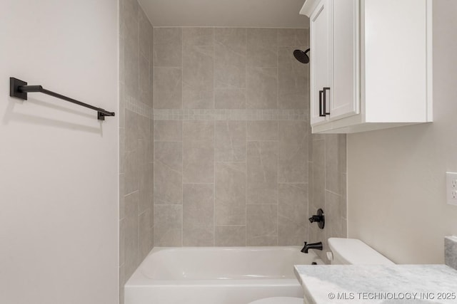 bathroom with toilet, washtub / shower combination, and vanity