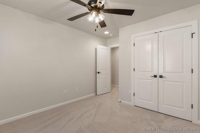 unfurnished bedroom with light carpet, baseboards, a ceiling fan, a closet, and recessed lighting