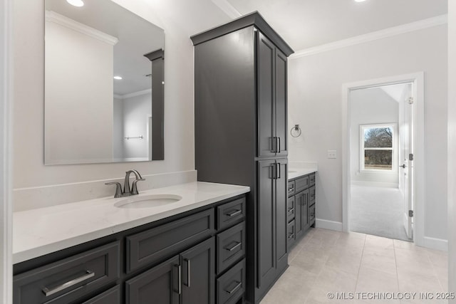 bathroom with tile patterned flooring, recessed lighting, vanity, baseboards, and ornamental molding