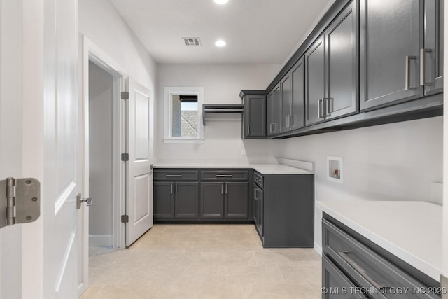 kitchen featuring visible vents, light countertops, and recessed lighting