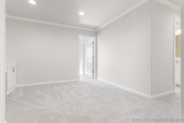 spare room featuring baseboards, recessed lighting, carpet, and crown molding