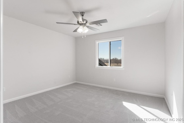 unfurnished room with ceiling fan, carpet floors, and baseboards