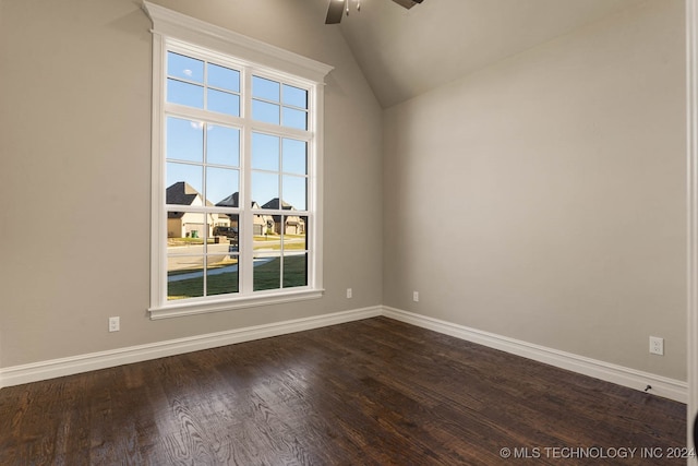 unfurnished room featuring ceiling fan, dark wood-type flooring, and vaulted ceiling