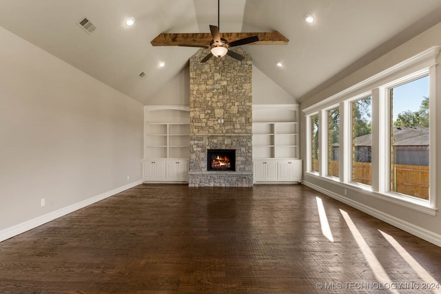 unfurnished living room featuring built in shelves, ceiling fan, dark wood-type flooring, a stone fireplace, and high vaulted ceiling