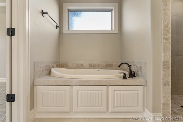 bathroom with tile patterned flooring and plus walk in shower