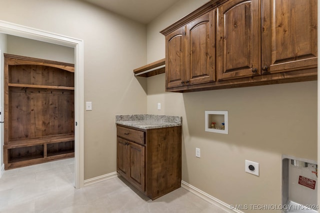 laundry room with hookup for a washing machine, cabinets, and hookup for an electric dryer