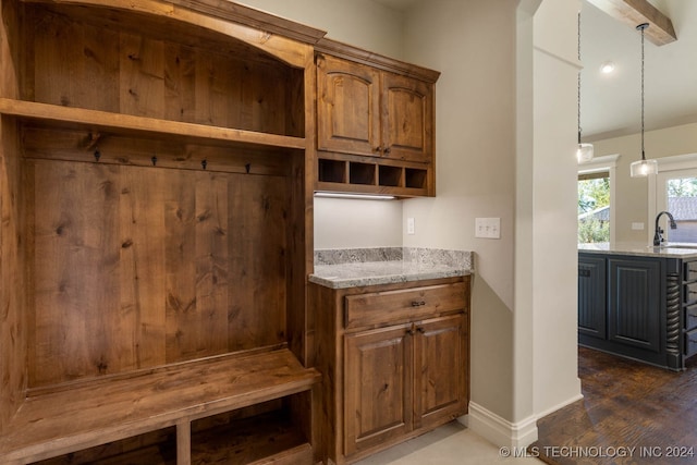 mudroom with sink and dark wood-type flooring