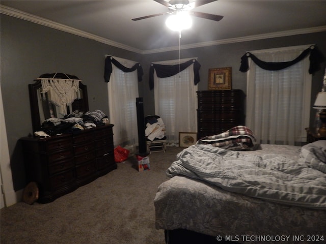 bedroom with ceiling fan, carpet, and crown molding