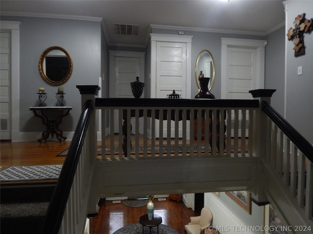 interior space featuring ornamental molding and hardwood / wood-style floors