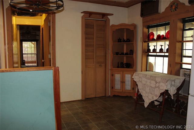 dining room with dark tile floors