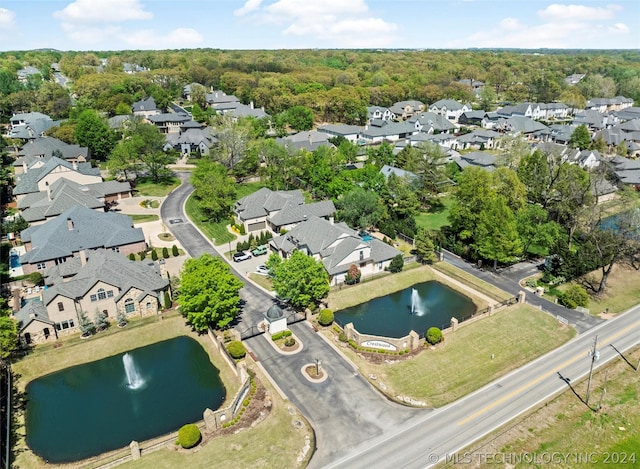 aerial view featuring a residential view and a water view