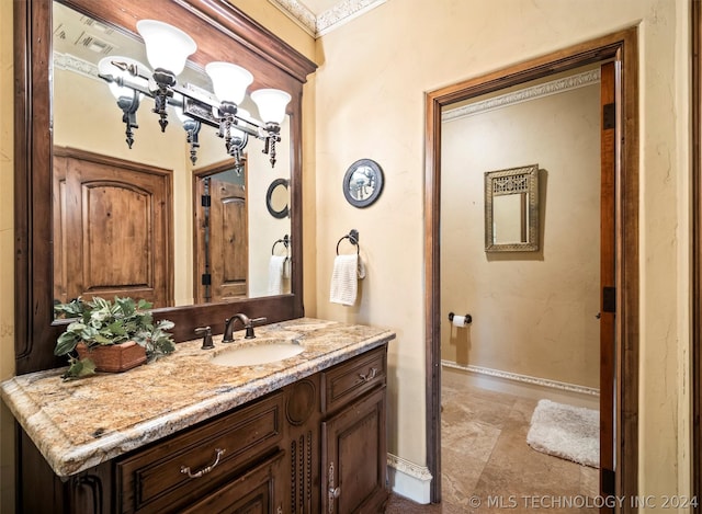 bathroom with baseboards and vanity