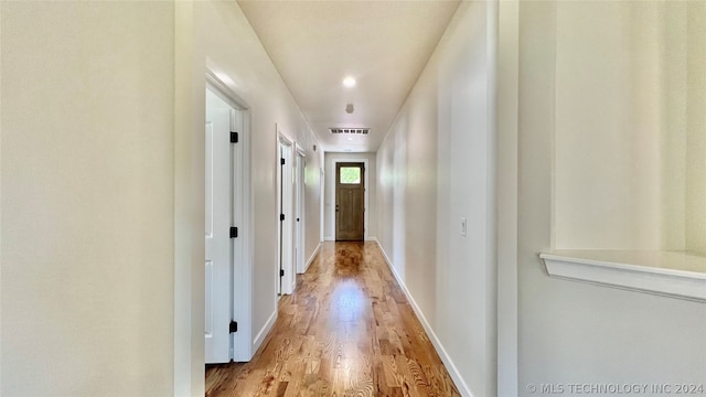 hallway featuring light hardwood / wood-style flooring