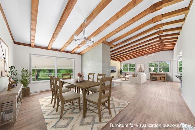 dining area featuring a healthy amount of sunlight, wood-type flooring, and lofted ceiling with beams