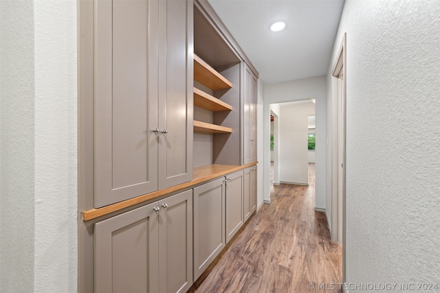 corridor with light hardwood / wood-style flooring