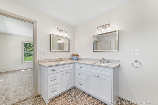 bathroom with tile flooring, double sink, and oversized vanity