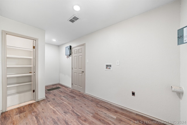 empty room with hardwood / wood-style floors