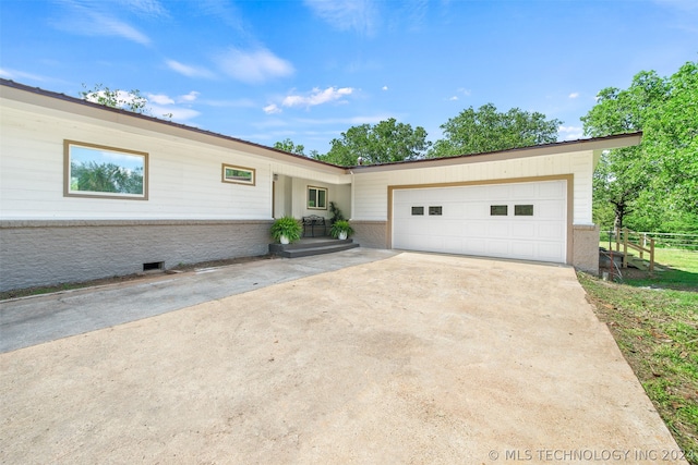 ranch-style home with a garage