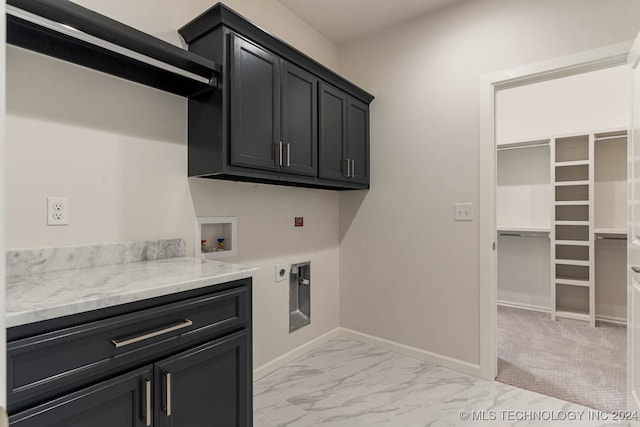 washroom with cabinets, washer hookup, light carpet, and hookup for an electric dryer