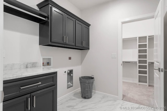 laundry room featuring washer hookup, electric dryer hookup, and cabinets