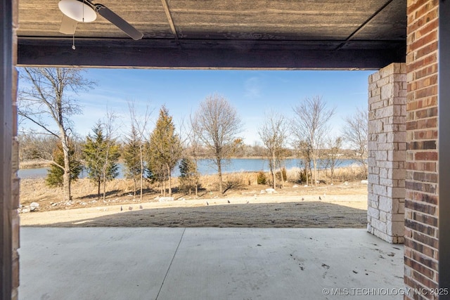 view of patio featuring a water view