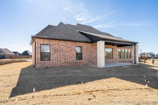 back of house with a patio area