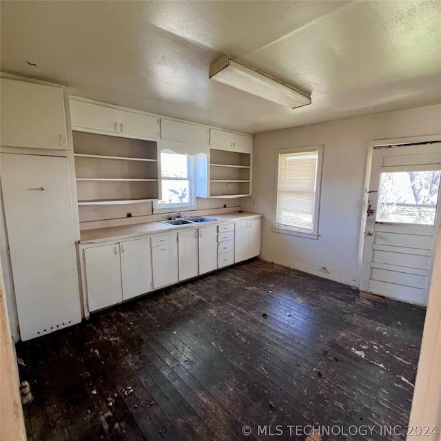 kitchen featuring a healthy amount of sunlight, white cabinets, and dark wood-type flooring