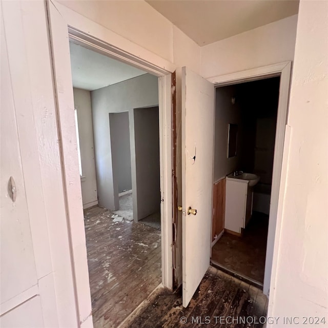 hall featuring sink and hardwood / wood-style flooring