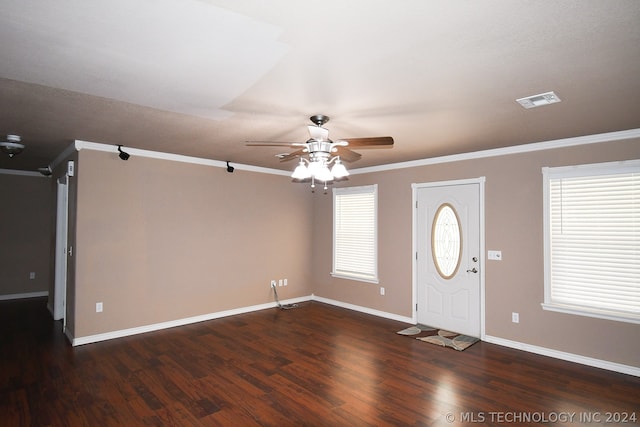 entrance foyer with dark hardwood / wood-style floors, ceiling fan, and crown molding