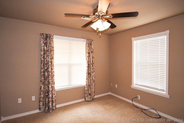 unfurnished room featuring carpet flooring and ceiling fan