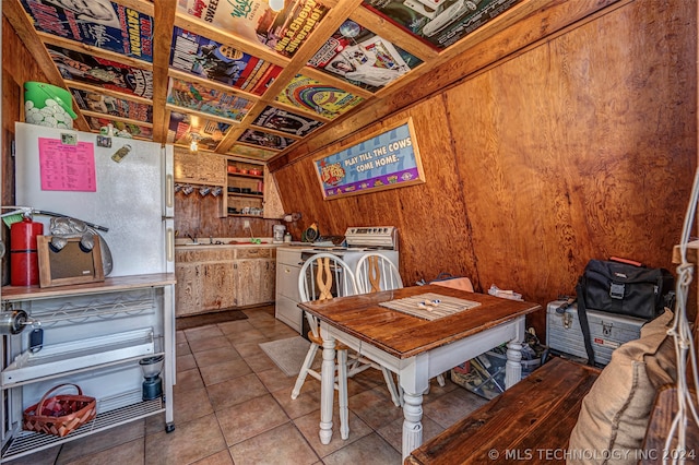 tiled dining space with wood walls