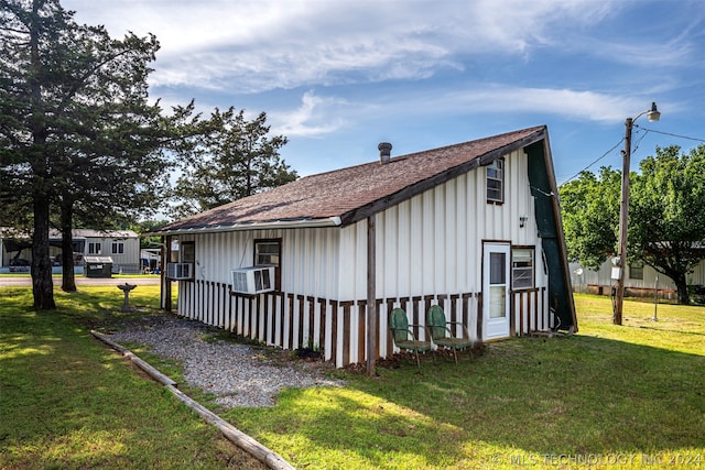 view of property exterior featuring a lawn