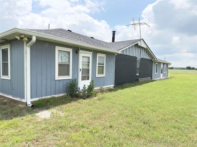 view of property exterior featuring a yard