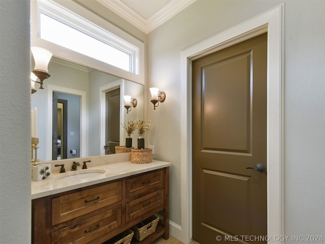 bathroom featuring vanity and ornamental molding