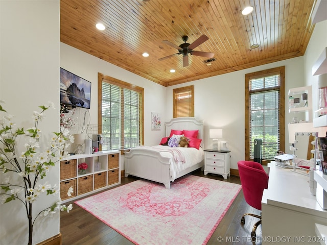 bedroom featuring wooden ceiling, crown molding, ceiling fan, and dark wood-type flooring