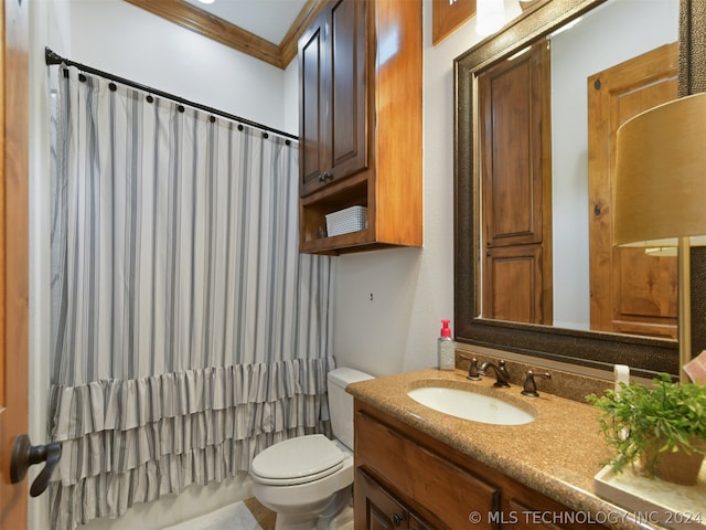 bathroom featuring vanity, toilet, and crown molding