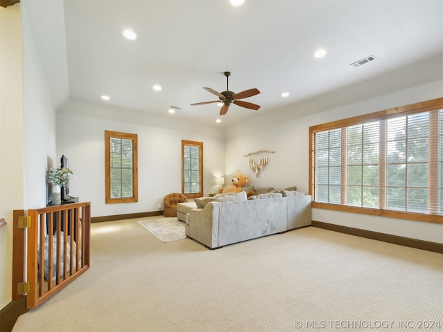 living room featuring carpet and ceiling fan