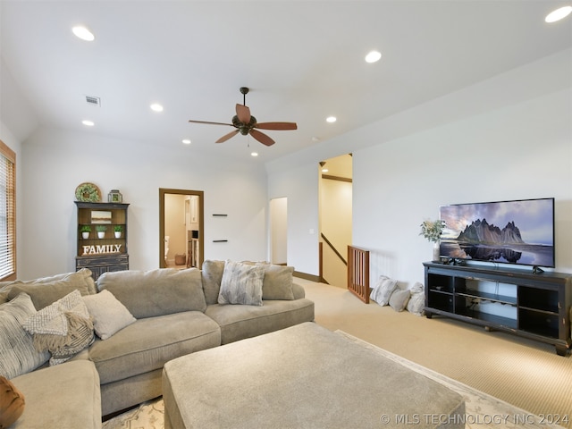 living room with ceiling fan and light colored carpet