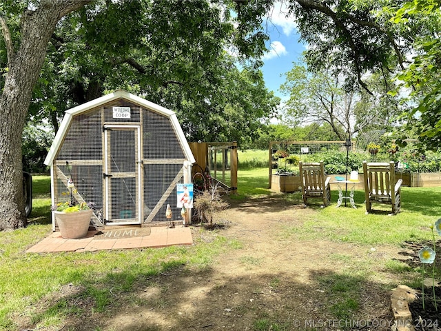 view of outdoor structure featuring a yard