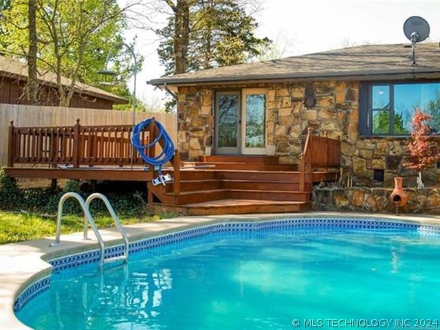 view of pool with a deck